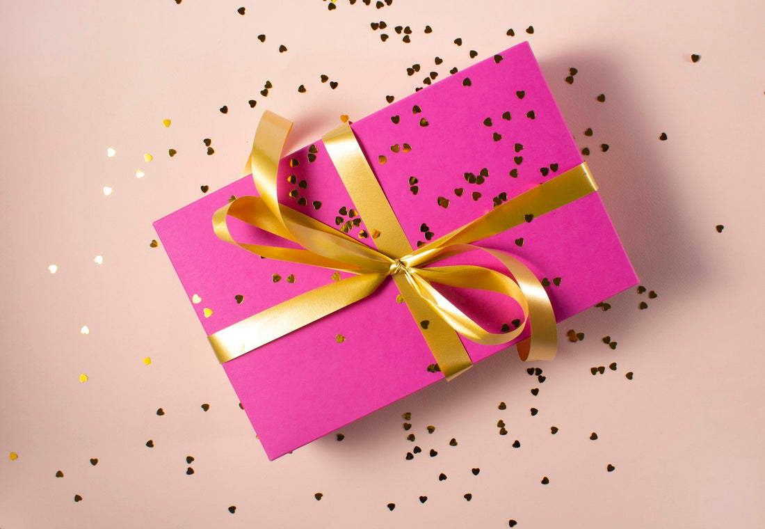 Designer gift wrapped in pink ribbon - Urban Muze gift guide for bags and eyewear