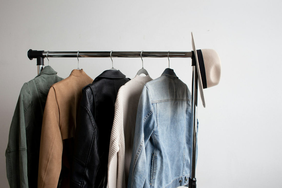 Designer wardrobe rack with neutral tone luxury garments - quiet luxury style edit