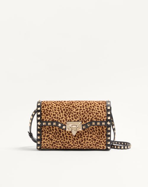 Valentino Garavani Rockstud small shoulder bag in pony-effect calfskin with animal print
